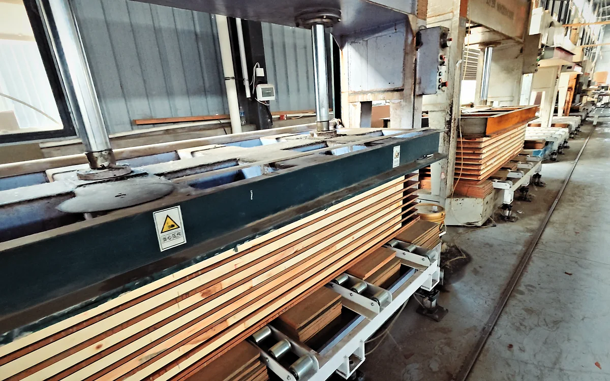 Multi-daylight hot press loaded with door blanks, main production floor