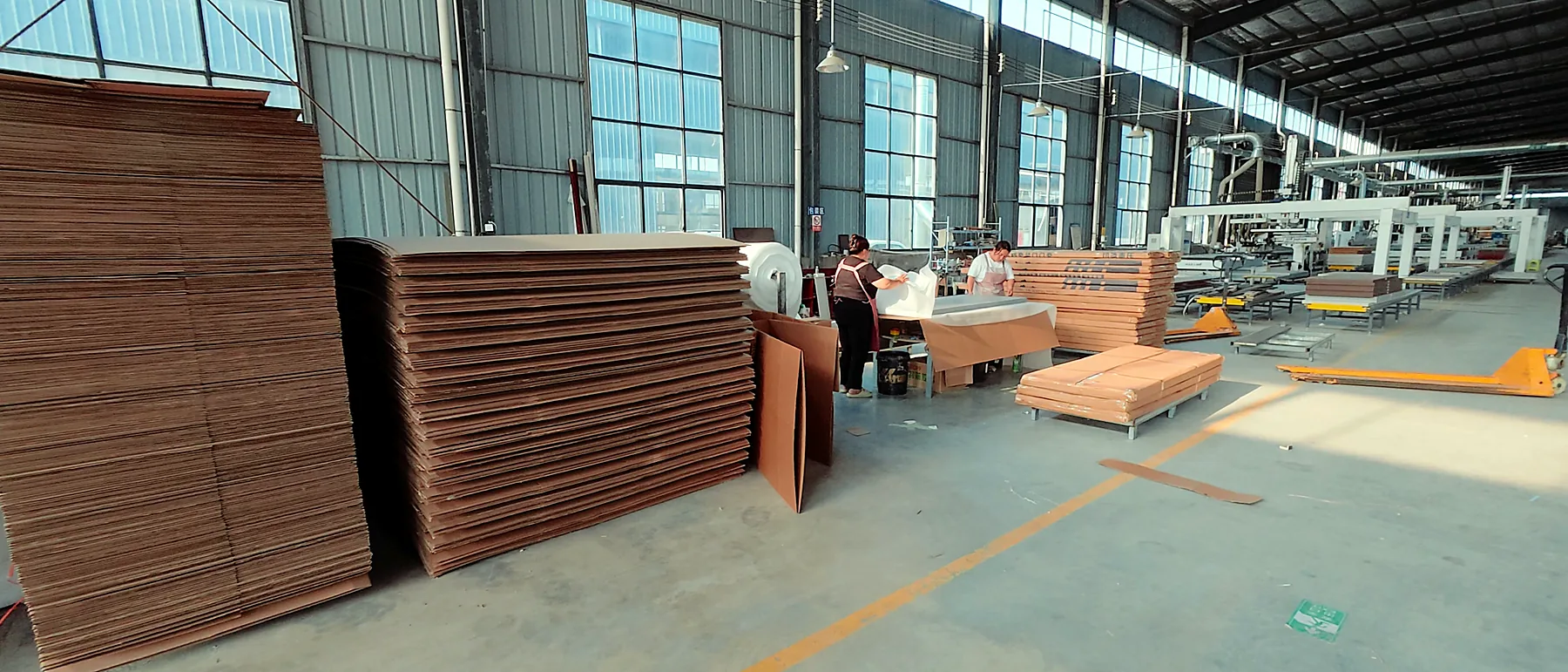 Main production workshop with panel staging and finished door leaves